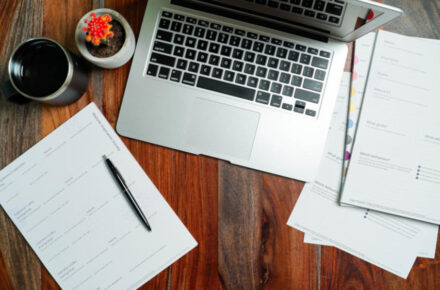 computer and paperwork on a desk